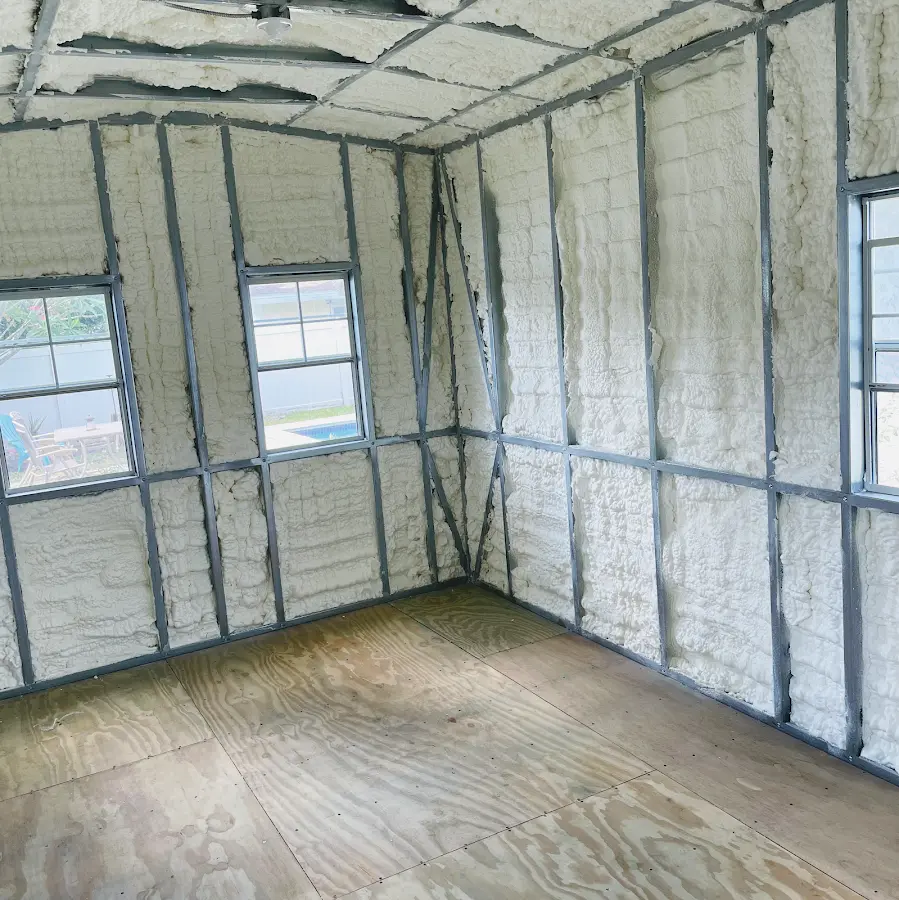 Closed-cell spray foam insulation applied to wall cavities in a residential project in Bedford
